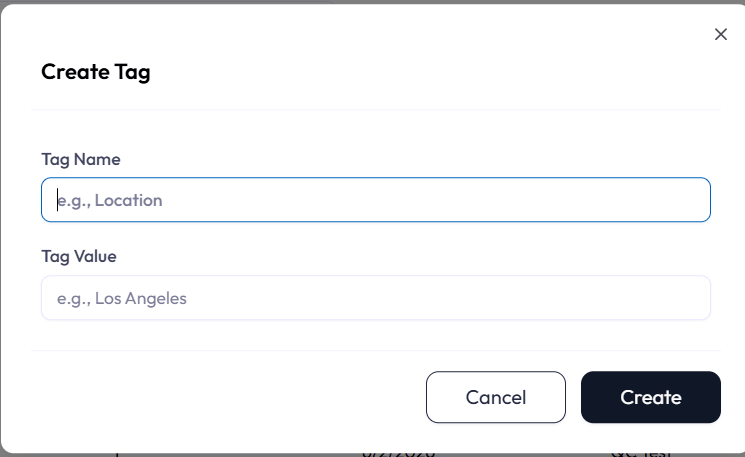 Create Tag modal with two fields: Tag Name with placeholder text reading e.g. comma Location, and Tag Value with placeholder text reading e.g. comma Los Angeles. Buttons read Cancel and Create.