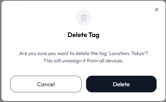 Delete Tag confirmation dialog. It asks Are you sure you want to delete the tag, names the tag as key colon value, and warns This will unassign it from all devices. Buttons read Cancel and Delete.