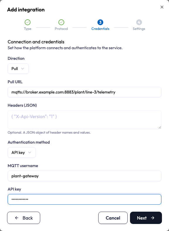 The Credentials step of the Add integration wizard for an MQTTS integration. Direction is Pull, the pull URL is an mqtts:// broker address, the authentication method is API key, and between them an MQTT username field holds the broker username. The API key field below it is masked.