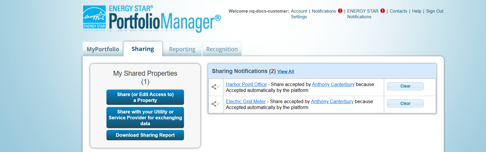 The Sharing tab in Portfolio Manager after the share. My Shared Properties shows a count of 1 above the Share (or Edit Access to) a Property, Share with your Utility or Service Provider for exchanging data, and Download Sharing Report buttons. Sharing Notifications lists the property and its electric meter, each recorded as a share accepted by the platform account because it was accepted automatically by the platform.